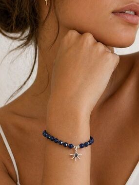 Marilyn Schiff Blue Beaded Bracelet w/ Silver Starburst Charm – Adjustable
